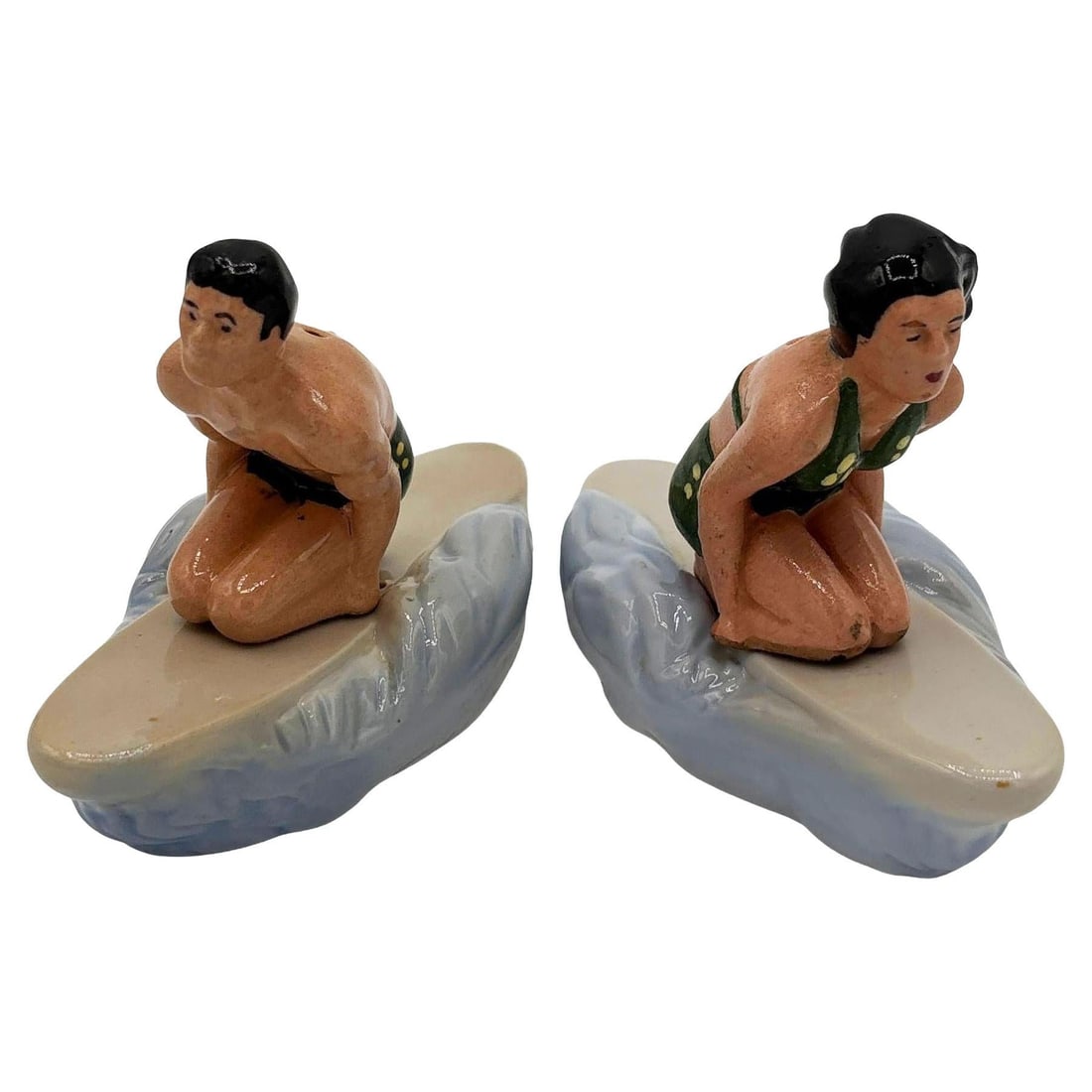 RARE 1951 Male & Female Surfer Ceramic Salt & Pepper Shaker Set by Herman's: Title: RARE 1951 Male & Female Surfer Ceramic Salt & Pepper Shaker Set by Herman's Description: Rare 1951 ceramic Hawaiian male & female surfer salt & pepper shaker set made by Herman's. The set featu