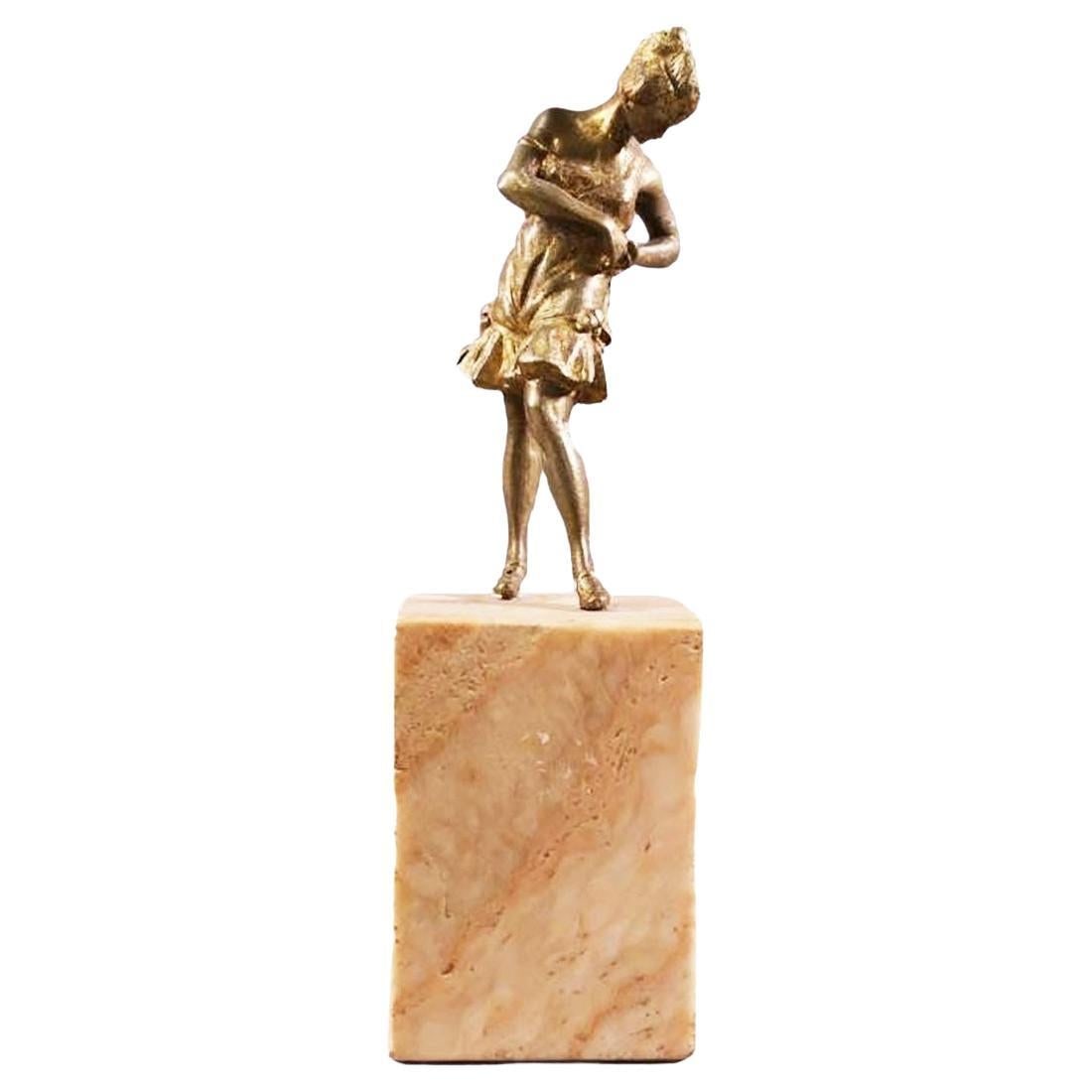 Brass Art Deco Flapper Girl Sculpture on Peach Marble Obelisk: Title: Brass Art Deco Flapper Girl Sculpture on Peach Marble Obelisk Description: This elegant Brass Art Deco flapper girl sculpture features a gracefully posed figure atop a peach-colored marble obel