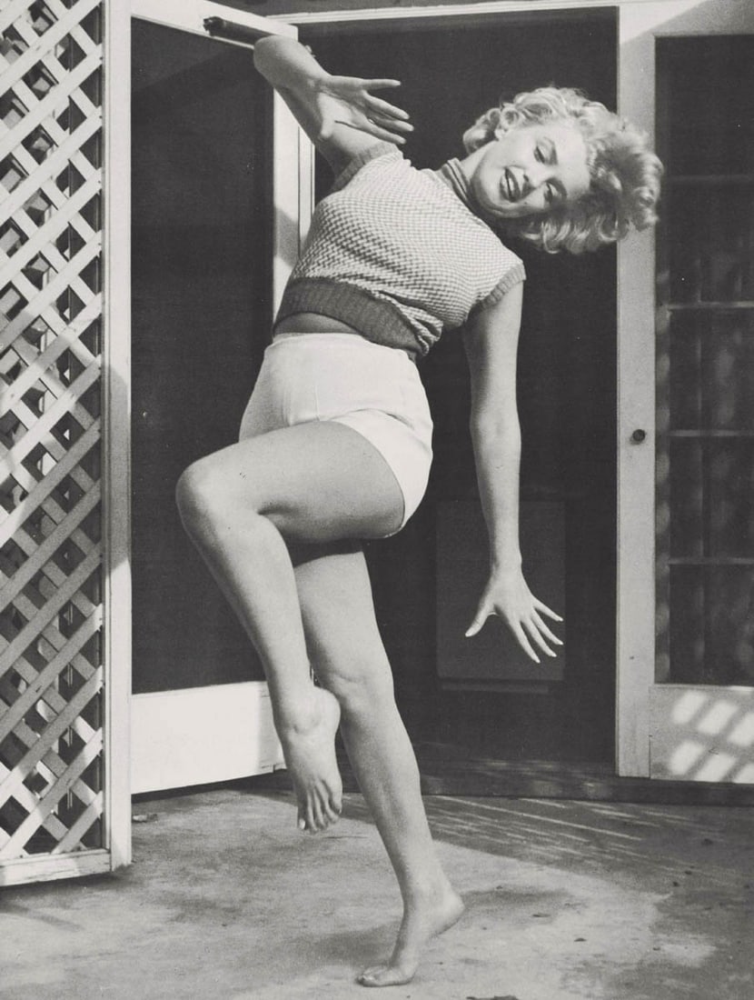 ANDRE DE DIENES - Marilyn Monroe (Norma Jean)(marching): Title: ANDRE DE DIENES - Marilyn Monroe (Norma Jean)(marching) Description: Artist: ANDRE DE DIENES Print Title: Marilyn Monroe (Norma Jean) Medium: Photo-lithograph Printed 1980’s in the US Image s