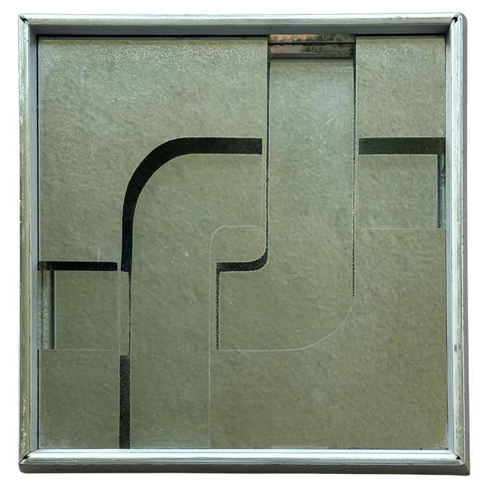 Little Pop Art Mirror in the style of Verner Panton: Title: Little Pop Art Mirror in the style of Verner Panton Description: This small wall mirror features a composition of layered geometric glass panels, creating a sense of depth and dimensionality. I