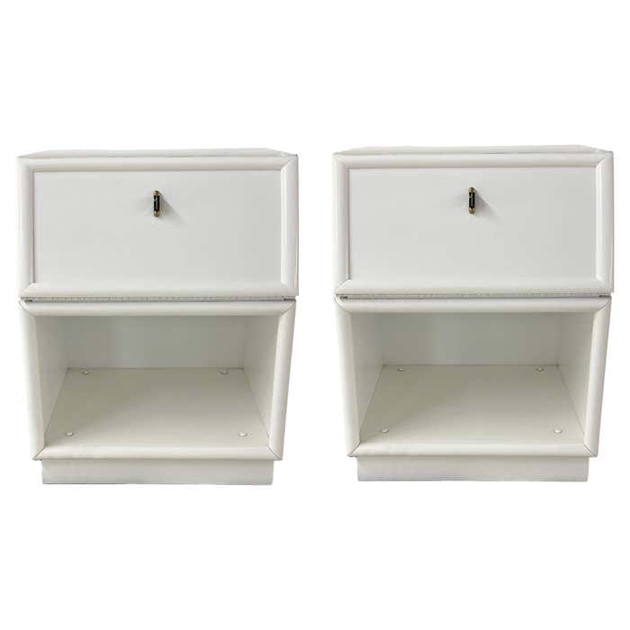 Pair of White Nightstands by Henredon: Title: Pair of White Nightstands by Henredon Description: This matching pair of white lacquer nightstands features drop-down front drawers, which also provide storage when closed. Each unit has a blac