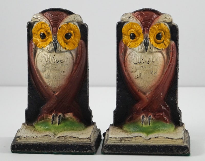 Owl on Book Bird Cast Iron Bookends: Title: Owl on Book Bird Cast Iron Bookends Dimension: 5 1/4" Height x 3 1/2" Width x 2 1/4" Depth. Date: Circa 1940's. Additional Information: A pair of Antique Owl on Book Bookends. Also, referred to