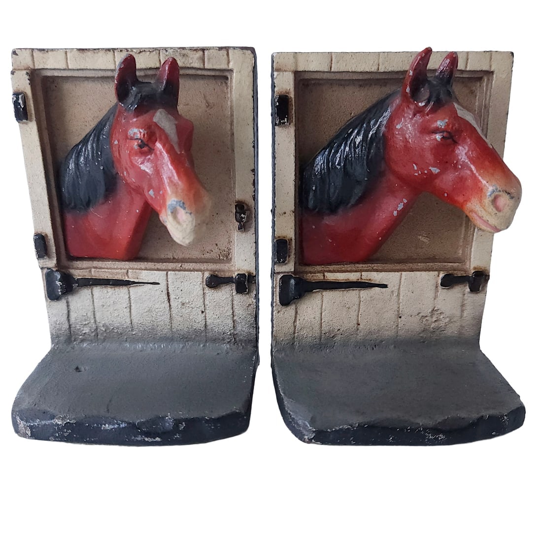 Pair of Hubley Painted Cast Iron "Horse at Stable Door" Bookends.: Title: Pair of Hubley Painted Cast Iron "Horse at Stable Door" Bookends. Description: Pair of Hubley Painted Cast Iron "Horse at Barn Door" Bookends. Hubley circa 1930s. The design depicts a horse's h