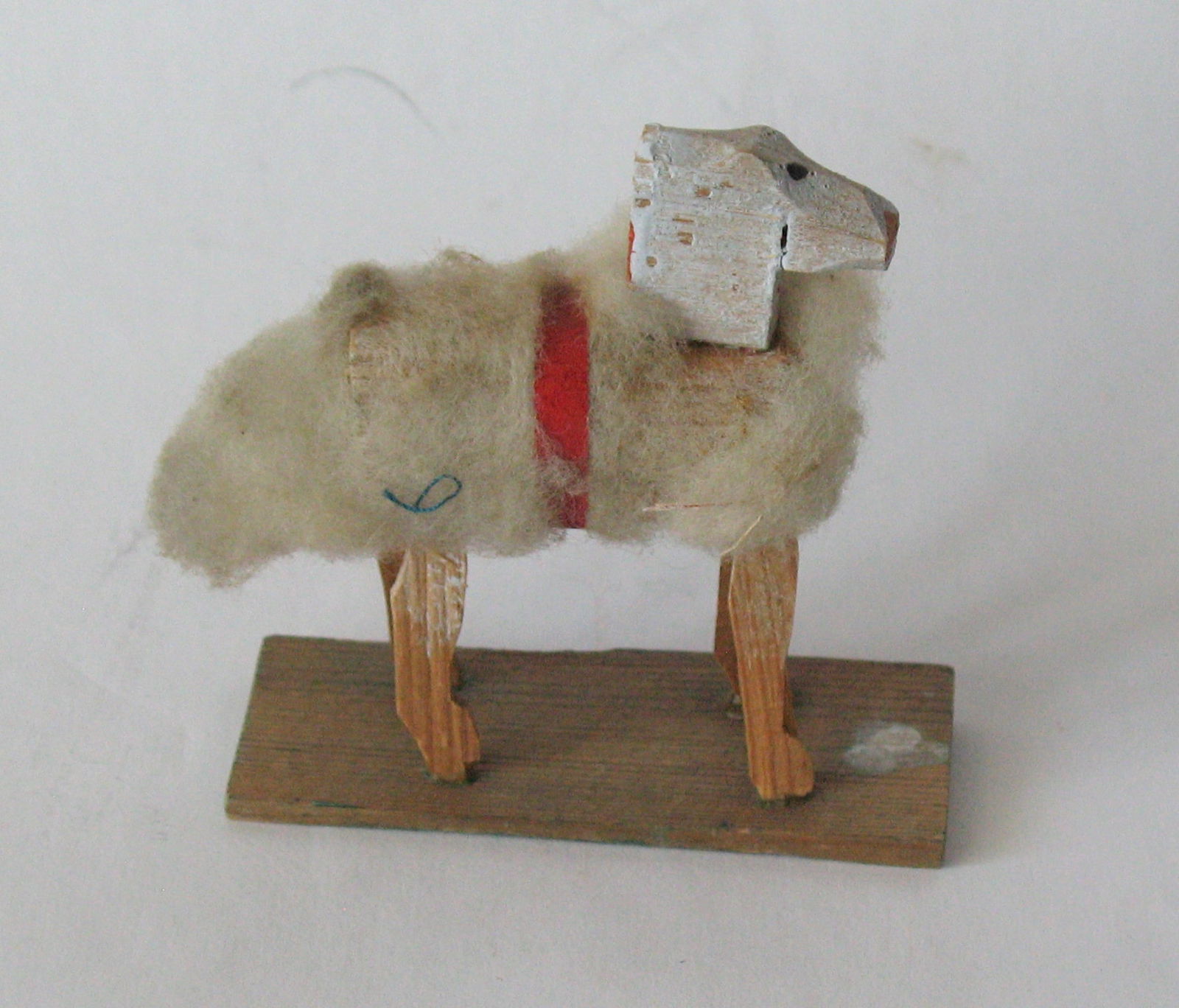Antique German woolly sheep on platform.: Title: Antique German woolly sheep on platform. Date/Period: 1900's Dimension: 2 1/2” x 1 1/4” x 2 1/2” high Additional Information: Nice antique German woolly sheep on platform in g