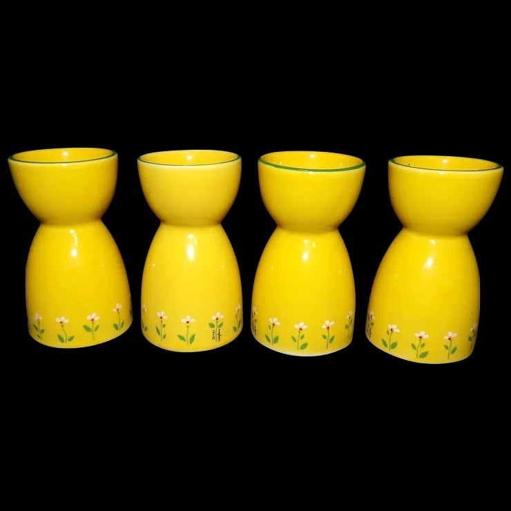 Vintage Yellow Ceramic Daisy Design Egg Cups: This set of 4 Vintage Yellow Ceramic Daisy Design Egg Cups are in excellent condition. NO chips, flea bites, stains, or loss of paint. They measure 3 ¾” tall with a cup 1 ¾” in d
