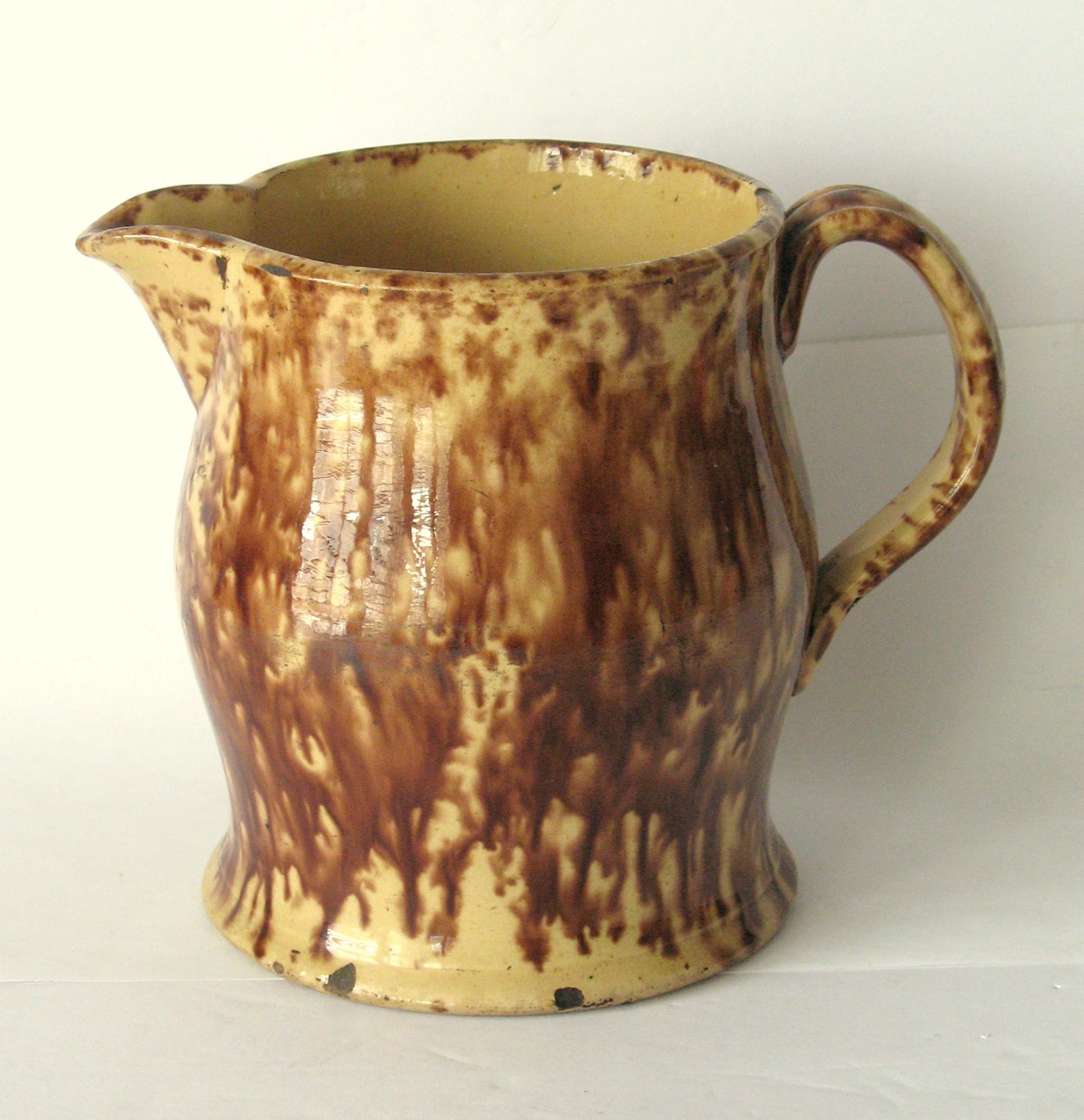 Antique yellow ware cream pitcher.