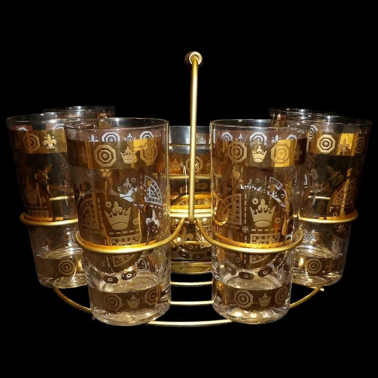 Signed Vito Bari 6 Gold Crest 22kt Gold Leaf Highball Glasses with Ice Bucket and Stand: This Signed Vito Bari 6 Gold Crest 22kt Gold Leaf Highball Glasses with Ice Bucket and Stand is missing two glasses which can be purchased online. These are in very good condition. They do have some m