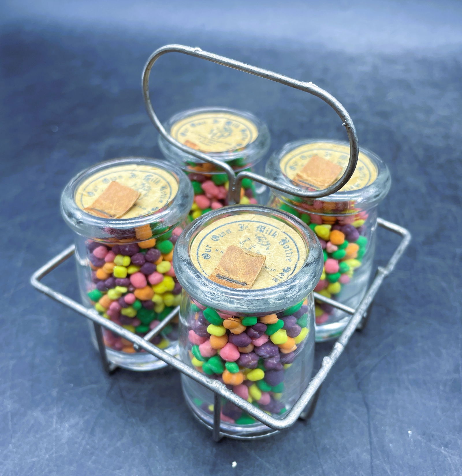 Rare 1930s CV HALL Chicago Dairy CREAMER CANDY CONTAINER: Date/Period: Approx. 1930's Dimension: carrier 3.5" x 3.25 x 3.25" bottles: 2" x 1.25" Material: metal, glass, paper caps Additional Information: 1930s CV HALL Chicago ILL dairy CREAMER glass CANDY CO