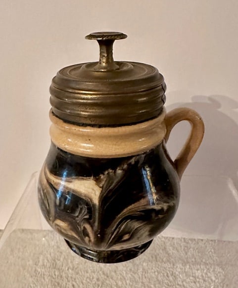 19th C. Mocha Ware Mustard Pot w/Lid (Added): A wonderful marbleized Mocha Ware Mustard Pot with an added lid (bronze). The pot has a wonderfully colorful (black, brown, blue, gray, white) swirl of marble decoration with white rim and handle 