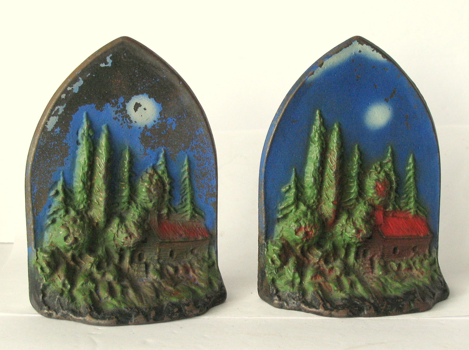 Antique cast iron Maine cabin in the woods bookends.: Title: Antique cast iron Maine cabin in the woods bookends. Date/Period: 1930's Dimension: 6 1/4” x 4 1/2” Additional Information: Nice pair of antique Maine cabin in the woods bookends in