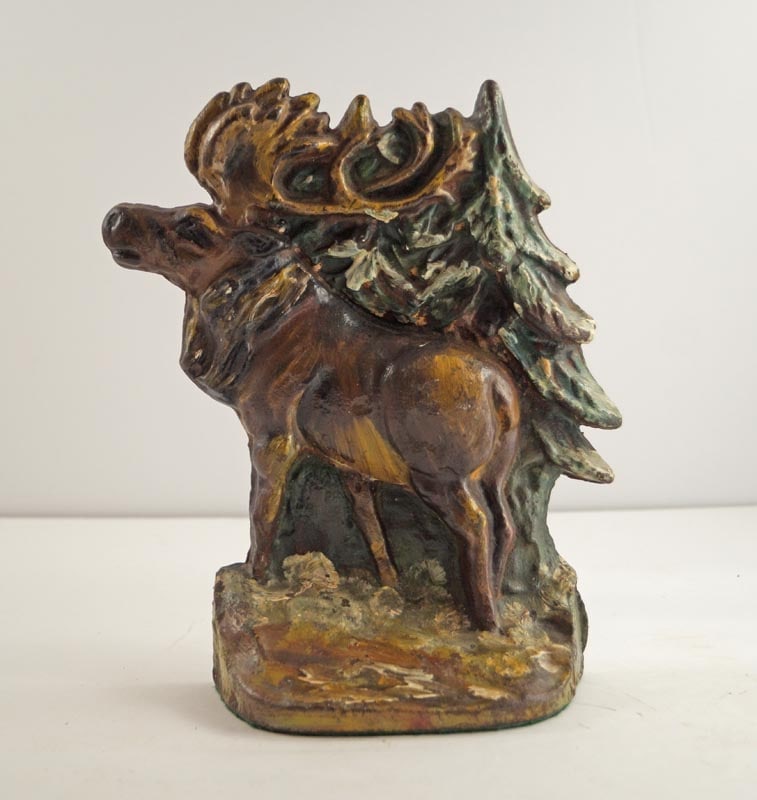 Antique Moose in Forest Cast Iron Doorstop: Title: Antique Moose in Forest Cast Iron Doorstop Dimension: 8 ¼” tall x 7 3/8” wide. Date: Ca. 1930’s. Additional Information: Incredible wild-life scene depicting Moose in For