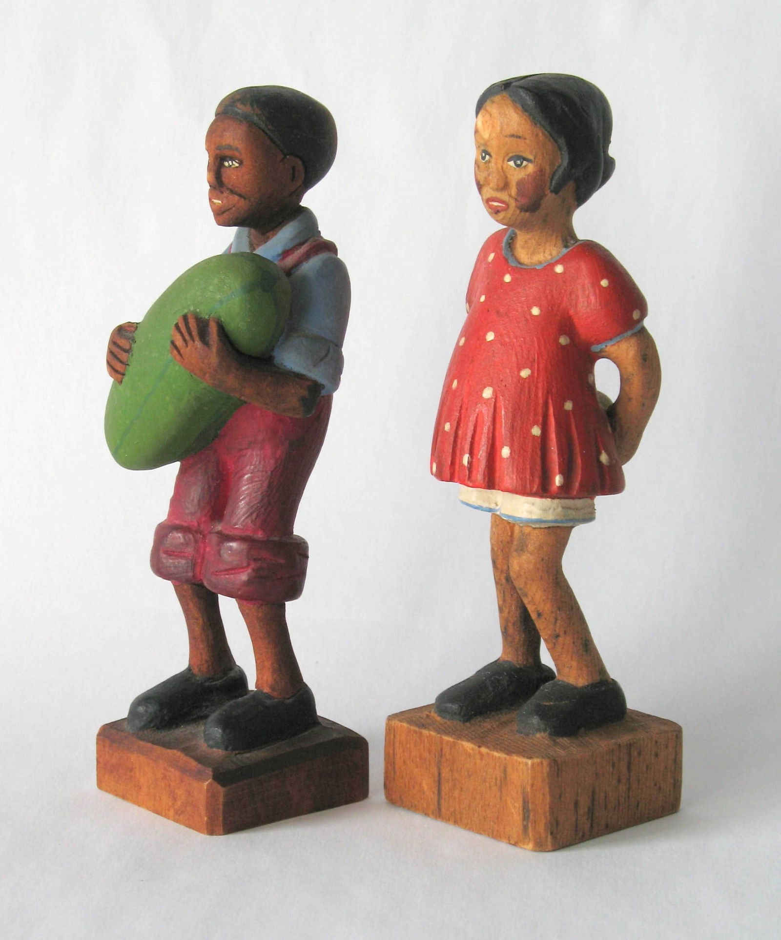 Antique folk art wood carvings by Tom brown.: Title: Antique folk art wood carvings by Tom brown. Date/Period: 1930's Dimension: 5” high each Additional Information: Pair of antique folk art wood carvings of 2 black children by Tom Brown in