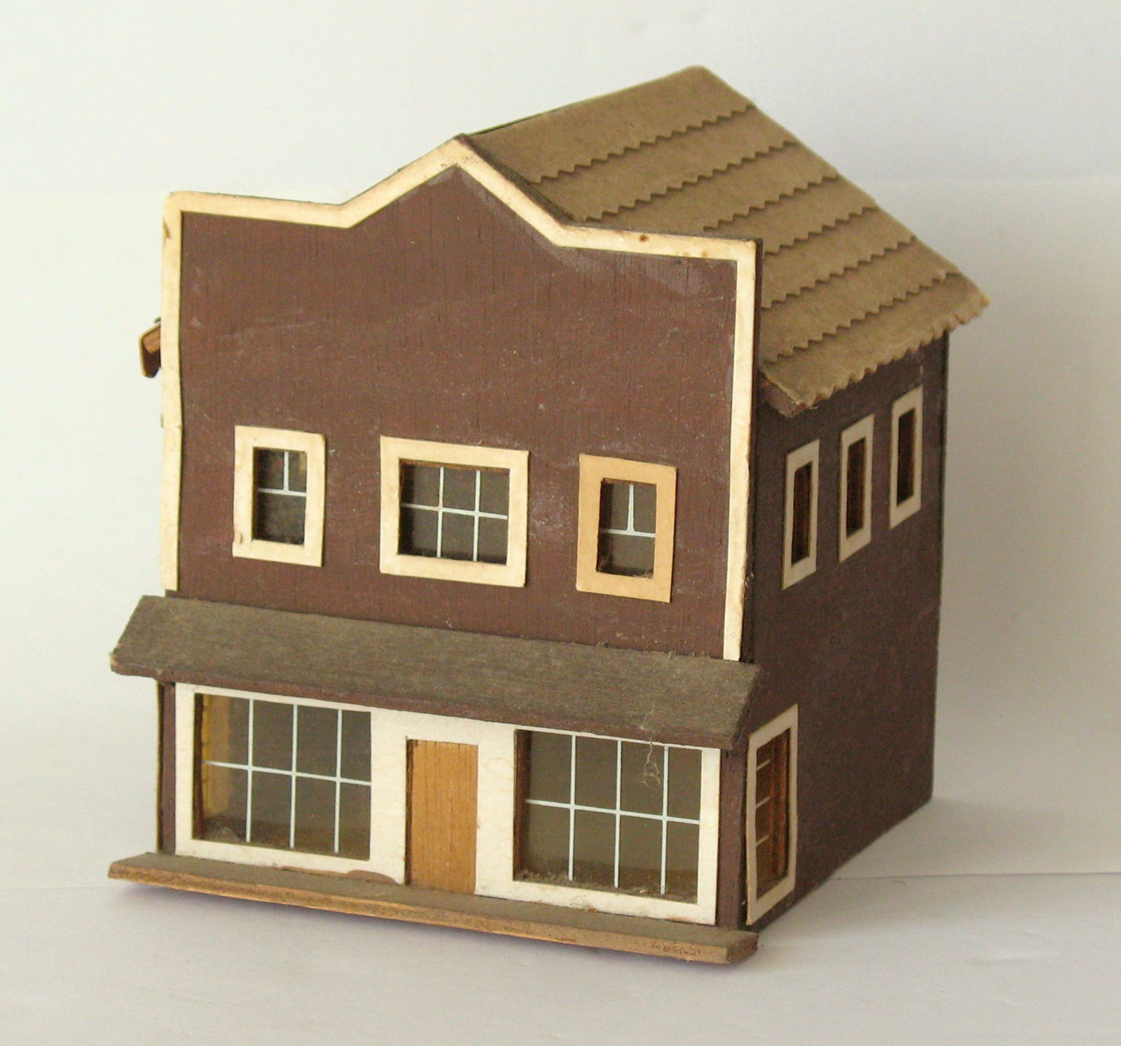 Antique folk art wood Christmas village store: Title: Antique folk art wood Christmas village store Date/Period: 1950's Dimension: 4 1/2” x 4 1/2” x 5” Additional Information: Nice antique folk art home made Christmas village sto