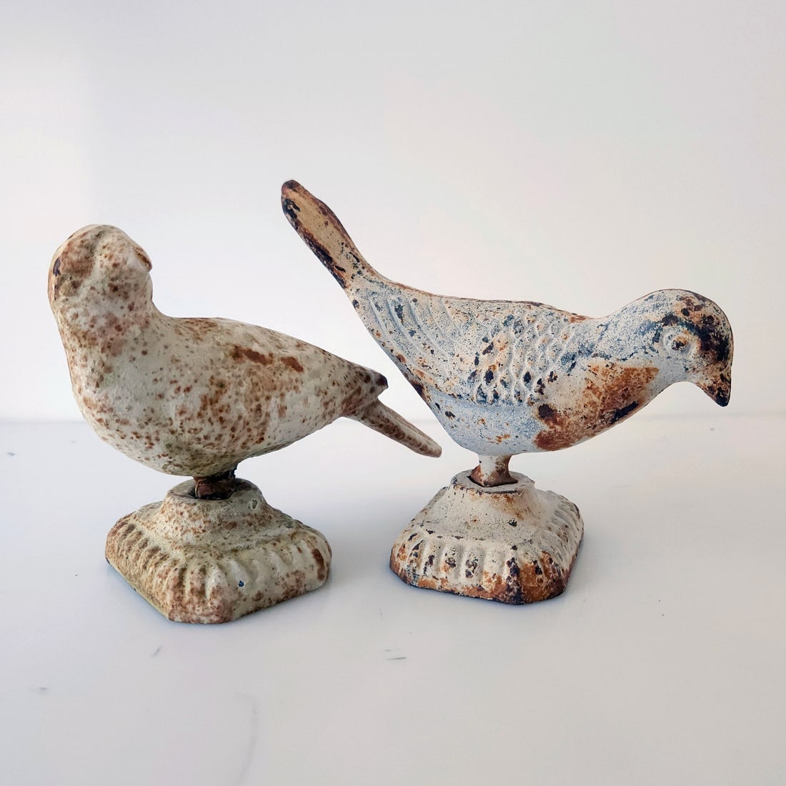Pair of Vintage Cast Iron Dove Bird Door Stops: Title: Pair of Vintage Cast Iron Dove Bird Door Stops Description: Off white shabby chic rustic farmhouse appearance. Minor rust which adds to the patina Heavy solid pieces weighing almost 4 lbs each.