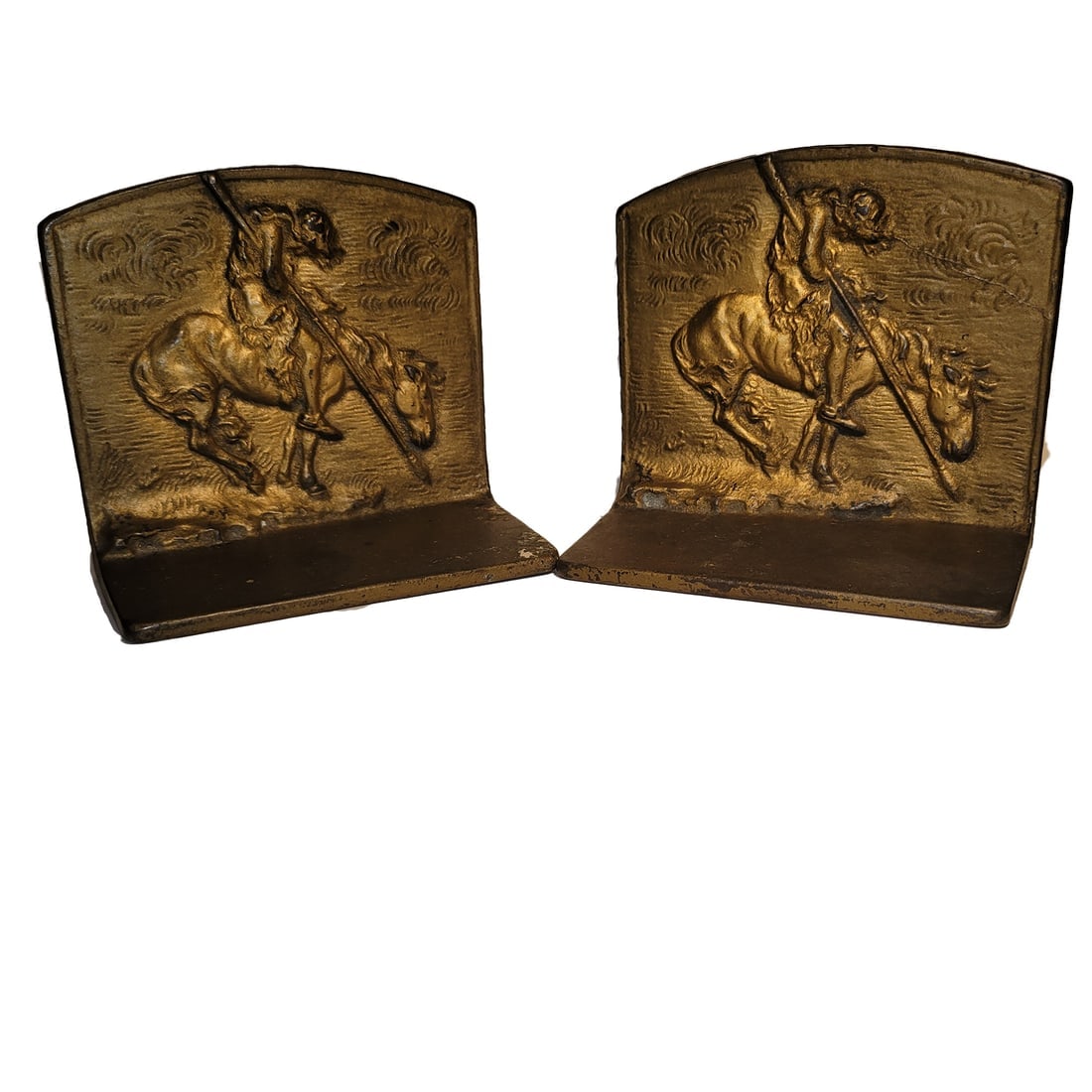 Vintage Bronzed Cast Iron End of the Trail Bookends: Title: Vintage Bronzed Cast Iron End of the Trail Bookends Description: Vintage Bronzed Cast Iron End of the Trail Bookends depicting a Native American Indian on Horse holding a spear. Circa 1928. No