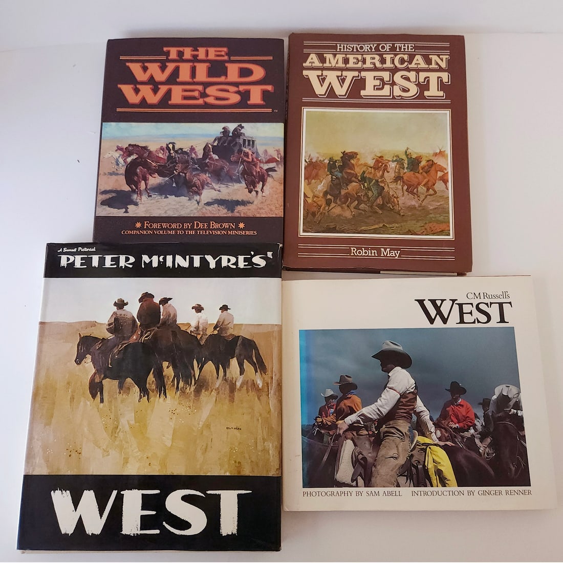 The West, the Wild, Wild West Book Collection: Title: The West, the Wild, Wild West Book Collection Description: 1987 CM Russell’s West: Photography by Sam Abell Intro by Ginger Renner 1987 1st ED Hard Cover with Dust jacket 1971 Peter Mcint