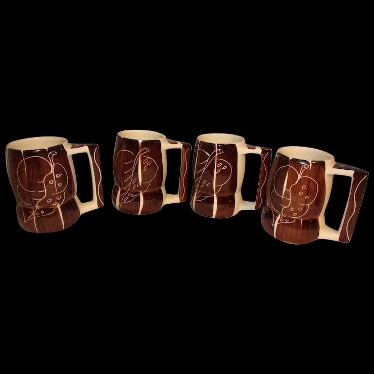 Purinton Pottery Slip Ware MCM Brown Intaglio Grand Mug: These Purinton Pottery Slip Ware Brown Intaglio Grand Mugs are in near MINT condition. They look as if they were never used. They measure 5" tall and 3" in diameter at the mouth of the mug. NO chips,
