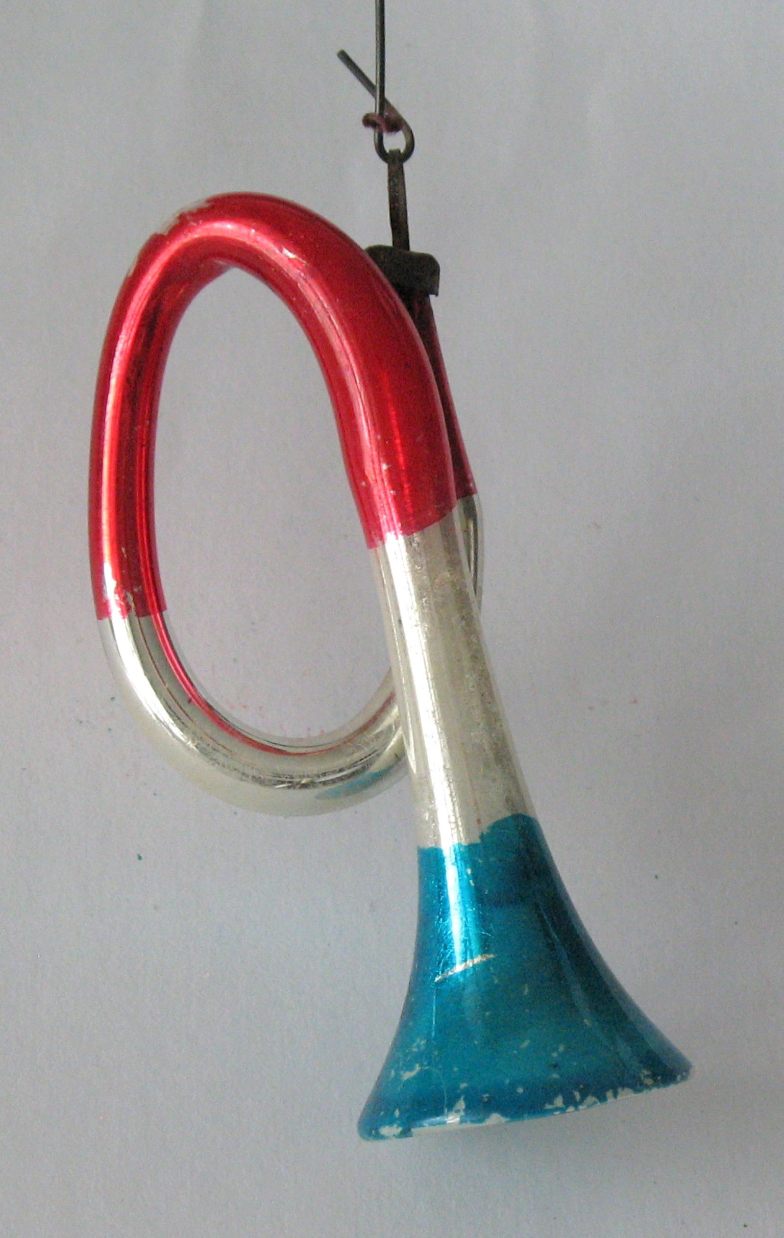 Antique red, white and blue horn Christmas ornament.: Title: Antique red, white and blue horn Christmas ornament. Date/Period: 1920's Dimension: 3 1/2” Additional Information: Nice antique red, white & blue French horn Christmas ornament in great a