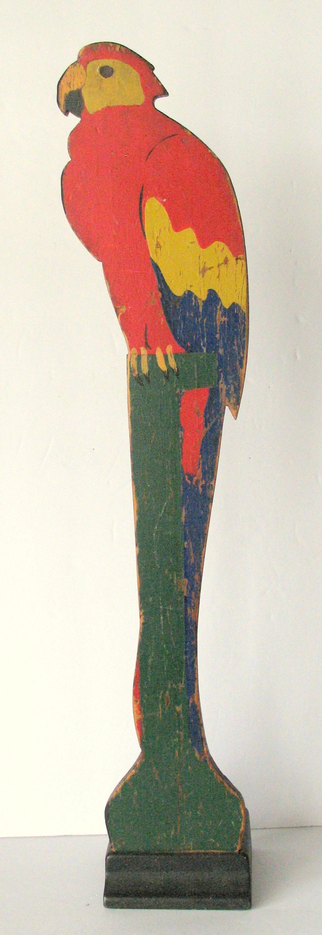 Antique wood and iron parrot door stop.: Title: Antique wood and iron parrot door stop. Date/Period: 1930's Dimension: 25” high Additional Information: Nice antique wood parrot on an iron base door stop in great original paint, patina