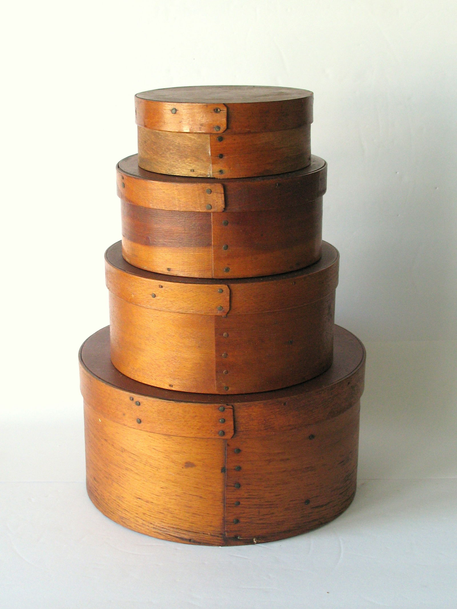 Group of 4 graduated antique pantry boxes.: Title: Group of 4 graduated antique pantry boxes. Date/Period: 1900's Dimension: 14” high largest 9 3/4” D Additional Information: Nice group of 4 graduated pantry boxes in all original pa