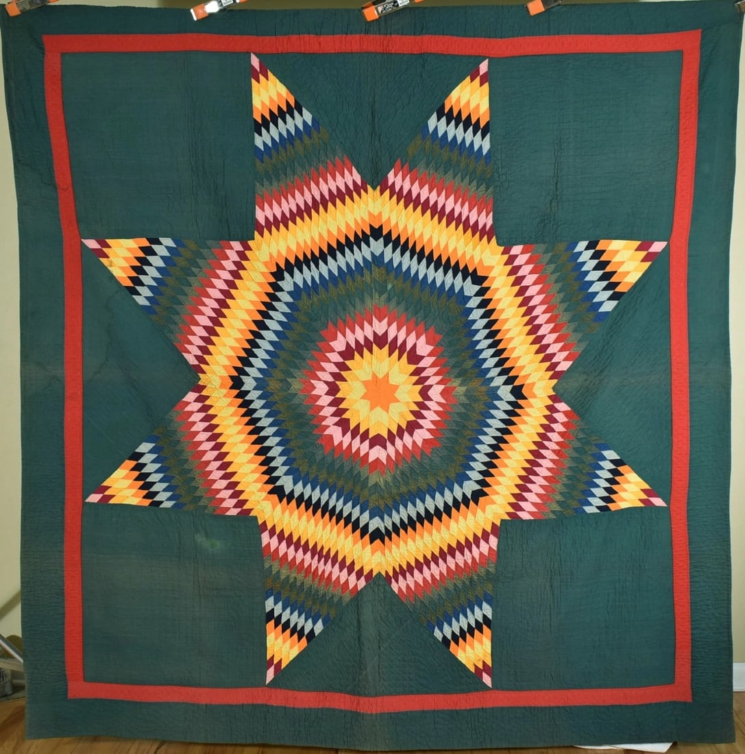 1890's PA Mennonite Lone Star Quilt: This GORGEOUS cotton 1880's / 1890's Pennsylvania Mennonite lone star quilt is hand pieced and hand quilted, with all solid colors, a deep green background, and small pieces that measure 1" - 1 1/4" p