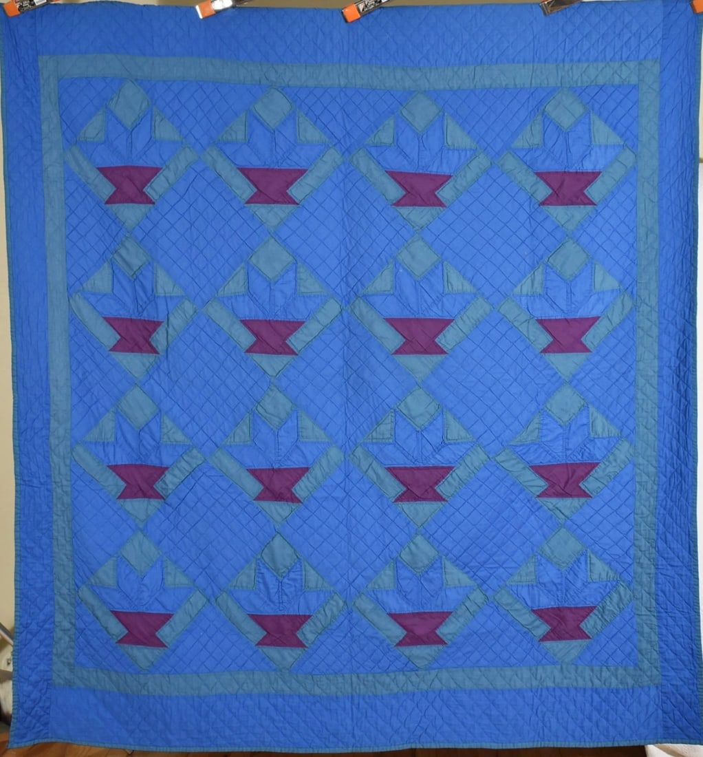 Authentic Amish Basket of Chips Quilt: This elegant cotton and cotton blend 40's/50's Amish basket of chips quilt is all treadle machine pieced and hand quilted, with patches made from Amish work clothes, on a light blue background. It mea