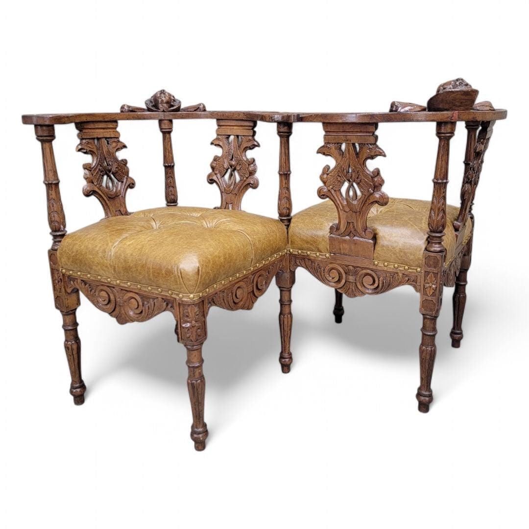 Antique Italian Renaissance Revival Ornate Carved Figural Tufted Tete-a-Tete Bench Newly: Antique Italian Renaissance Revival Carved Ornate Figural Walnut Button Tufted Tete-a-Tete Parlor Bench Newly Reupholstered in Italian Full Grain Distressed Whiskey Italian Leather This exquisite Anti