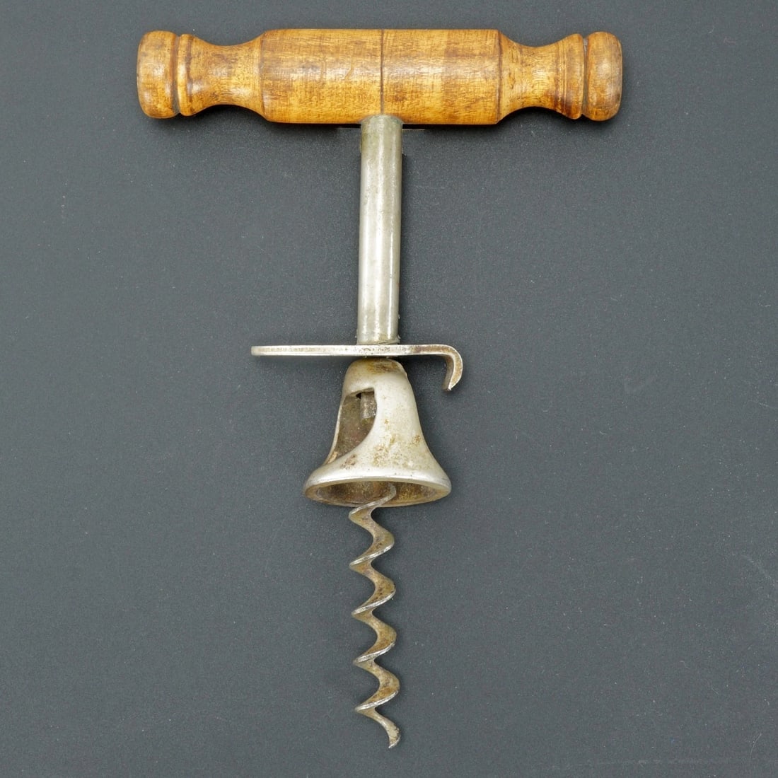 Antique Williamson's Corkscrew with Cutter: Title:Antique Williamson's Corkscrew with Cutter Size:6 in (15.2 cm) long x 4 in (10.2 cm) wide x 1 ¼ in (3.2 cm) thick. Description:A well-used corkscrew with a wire breaker and cap lifter to