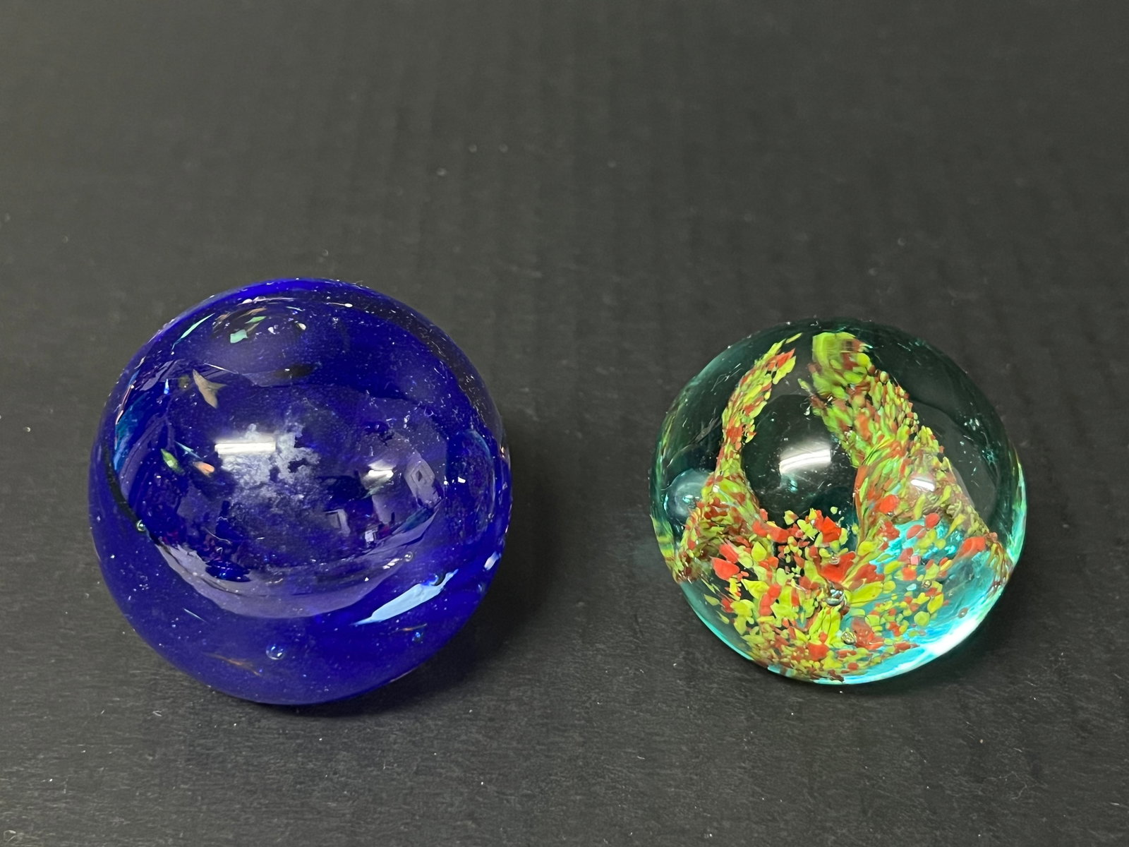 Late 20th Century Vintage Art Glass Paperweights Set of 2: Title: Late 20th Century Vintage Art Glass Paperweights Set of 2 Date/Period: Late 20th Century Description: Vintage Art Glass Paperweights Set of 2 Materials: Glass Size: 2" h x 2" w Reserve: $20.00