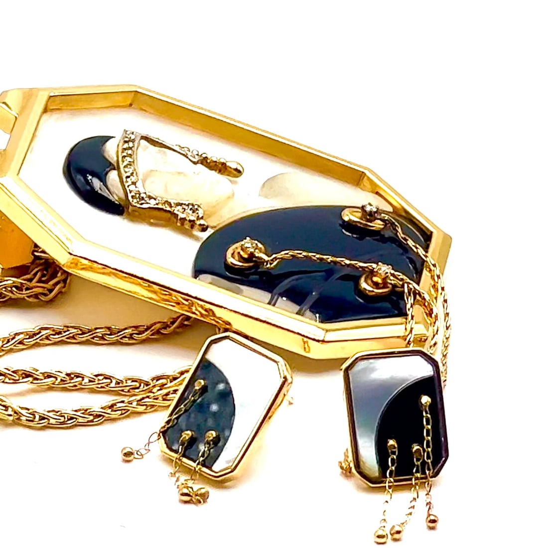 ERTE Folies 14k Yellow Gold Diamond Onyx Mother of Pearl Necklace & Earrings Set: ERTE Folies 14k Yellow Gold Diamond Onyx Mother of Pearl Necklace & Earrings Set About This Piece: This exceptionally rare piece of ERTE jewelry was designed in 1970's, and is number 19 of a series of