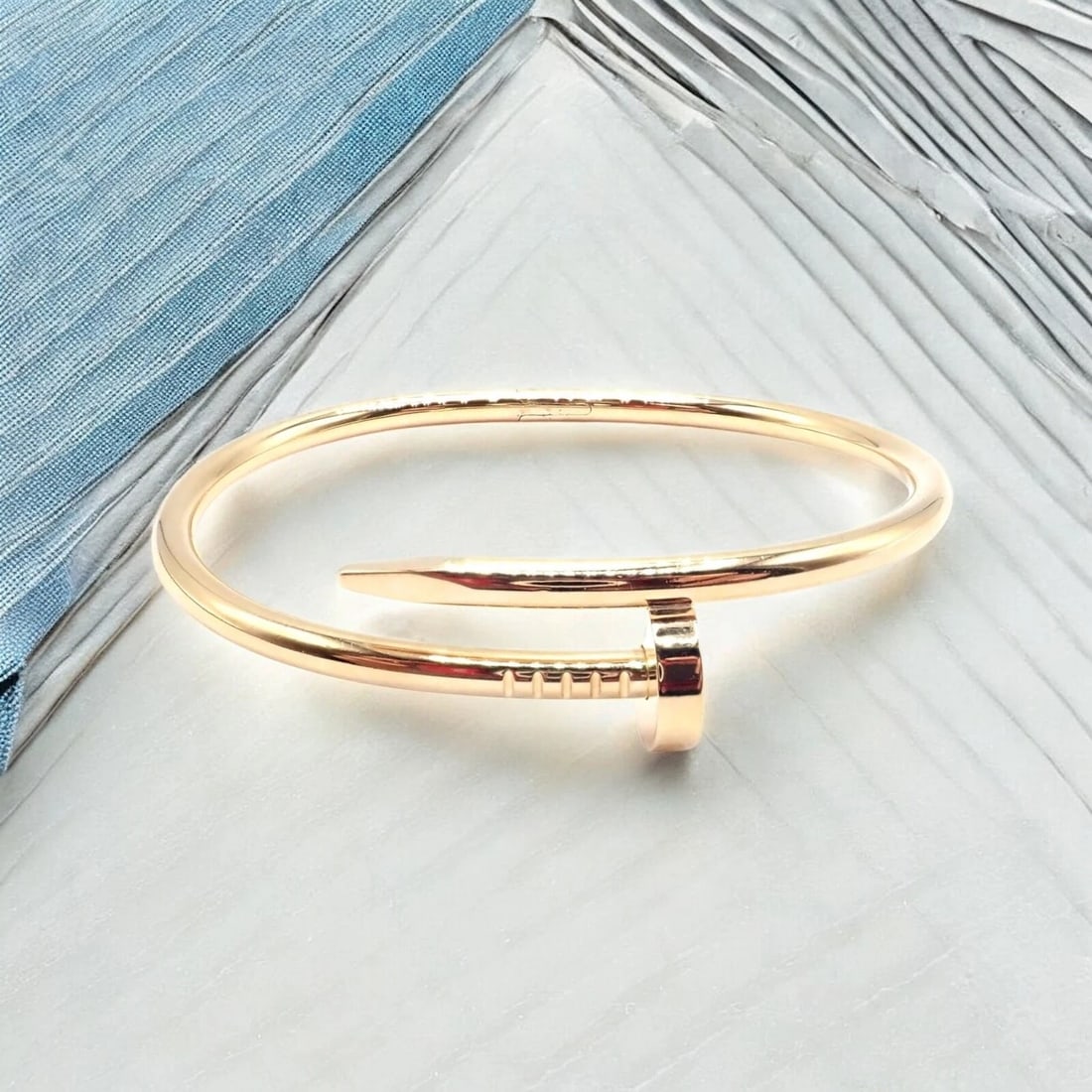 Cartier Juste un Clou Nail 18k Yellow Gold Bangle Bracelet Size 17 Paper: Cartier Juste un Clou Nail 18k Yellow Gold Bangle Bracelet Size 17 Paper About This Piece: Cartier's iconic Juste un Clou bangle in 18k yellow gold reimagines the humble nail as an audacious statement