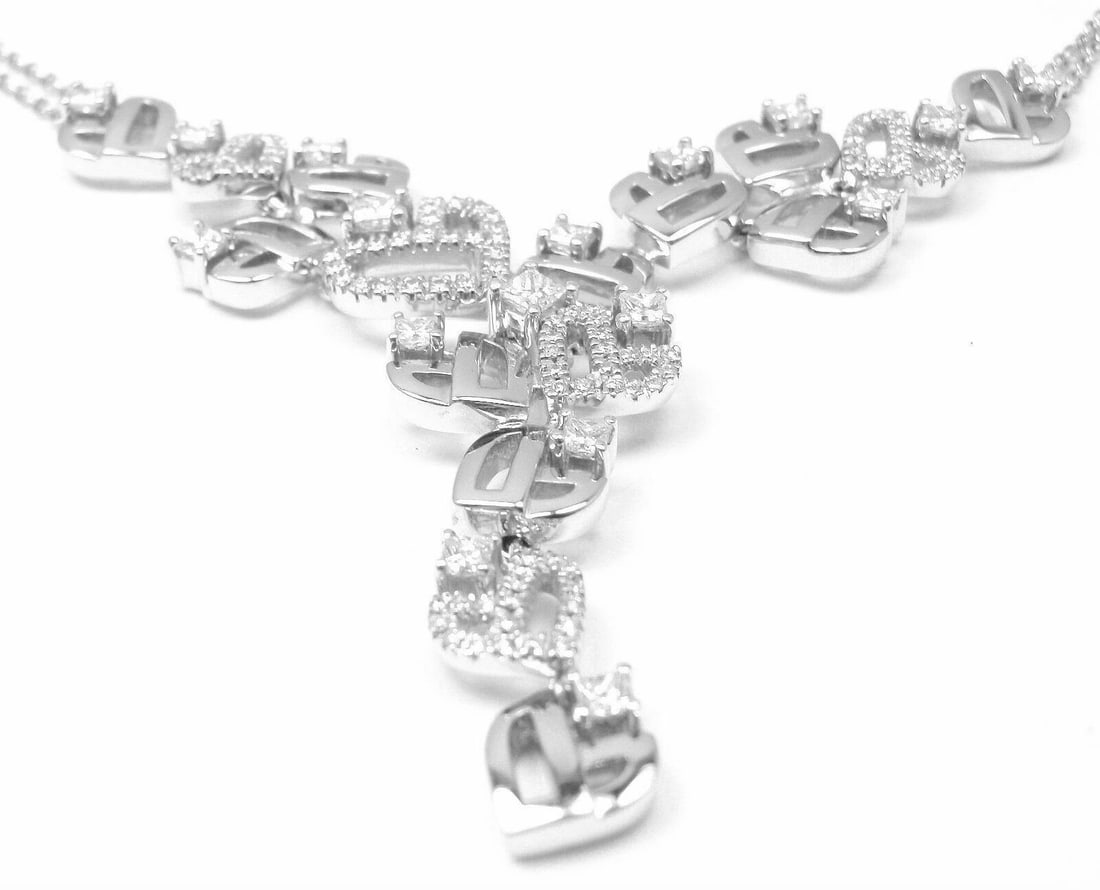 Authentic Damiani 18k White Gold Diamond Drop Necklace: Authentic Damiani 18k White Gold Diamond Drop Necklace About This Piece: This Necklace comes with Box and Certificate Retail: $17,940.00 Metal: White Gold Measurements: Pendant: 50mm x 5mm Length: 14"