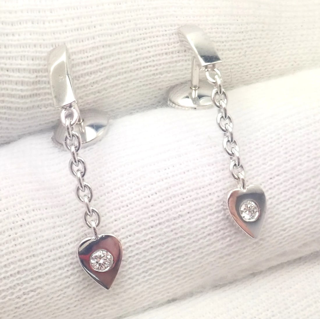 Authentic! Cartier 18k White Gold Diamond Mon Amour Dangle Heart Earrings: Authentic! Cartier 18k White Gold Diamond Mon Amour Dangle Heart Earrings About This Piece: Metal: 18k White Gold Measurements: Dangles 31mm - Heart Width 5mm Stones: 2x round brilliant cut diamonds t