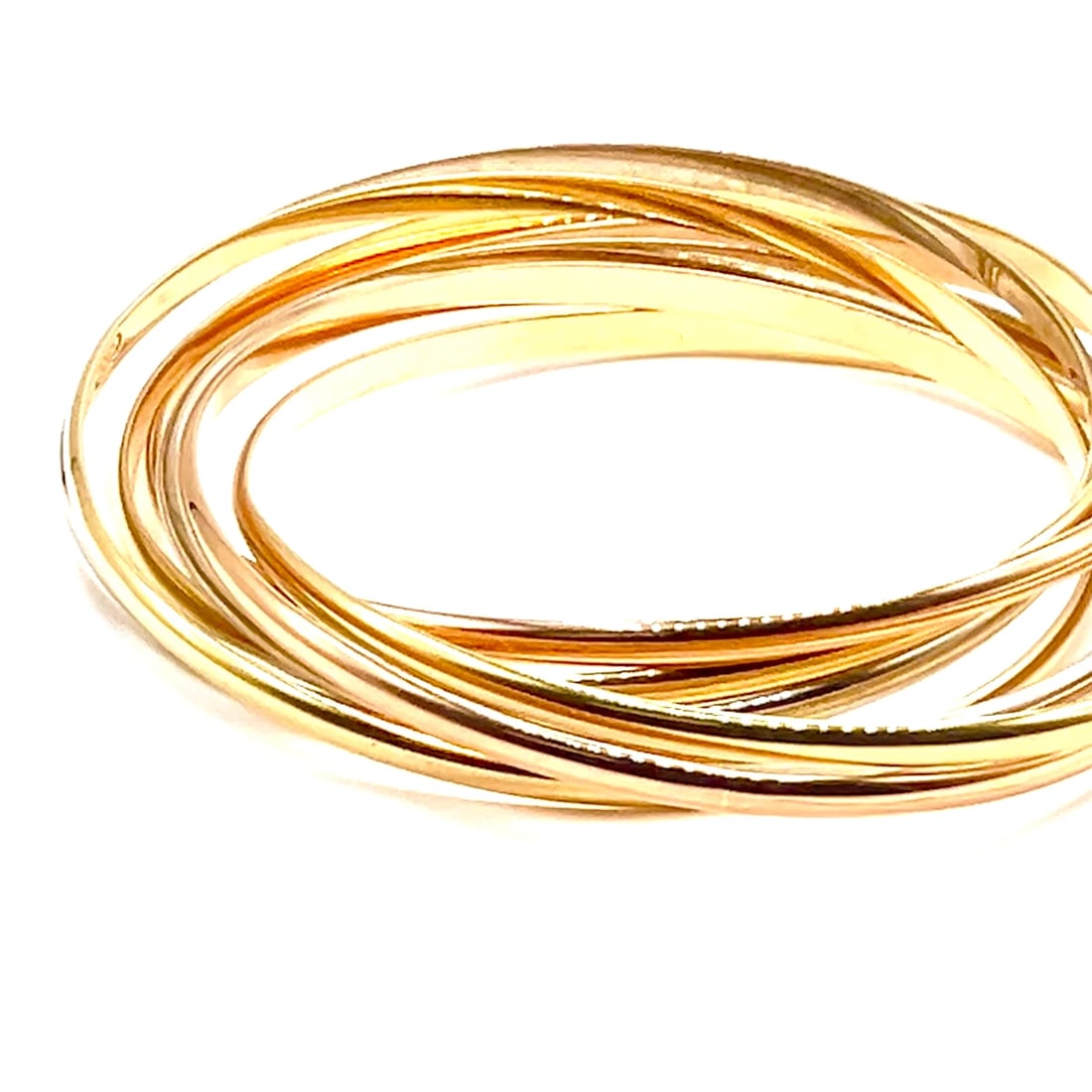 Authentic! Vintage Cartier 18k Tricolor Gold 7 Band Trinity Bangle Bracelet: Authentic! Vintage Cartier 18k Tricolor Gold 7 Band Trinity Bangle Bracelet About This Piece: The Vintage Cartier Trinity Bangle Bracelet features seven interlocking bands of 18k gold in yellow, white