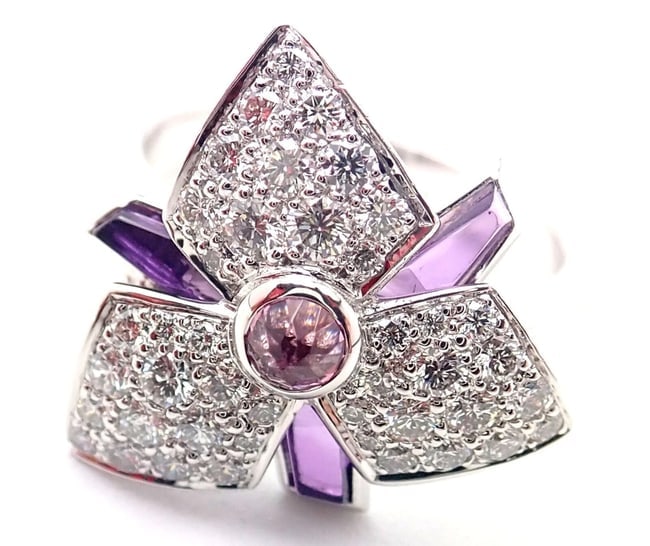 Cartier Caresse D'orchidees Orchid Flower 18k White Gold Diamond Amethyst Ring: Cartier Caresse D'orchidees Orchid Flower 18k White Gold Diamond Amethyst Ring About This Piece: The Cartier Caresse d'Orchidees Orchid Flower Ring is a masterpiece of jewelry artistry, crafted from 1