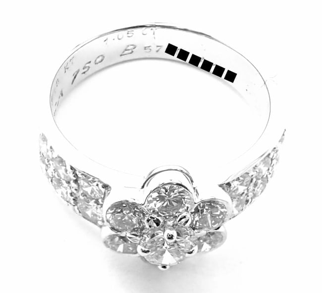 Authentic! Van Cleef & Arpels 18k White Gold Diamond Fleurette Flower Ring: Authentic! Van Cleef & Arpels 18k White Gold Diamond Fleurette Flower Ring About This Piece: Metal: 18k white gold Measurements: Size 4 1/4 Width: 9mm Weight: 4.6 grams Stones: 19 Round brilliant cut