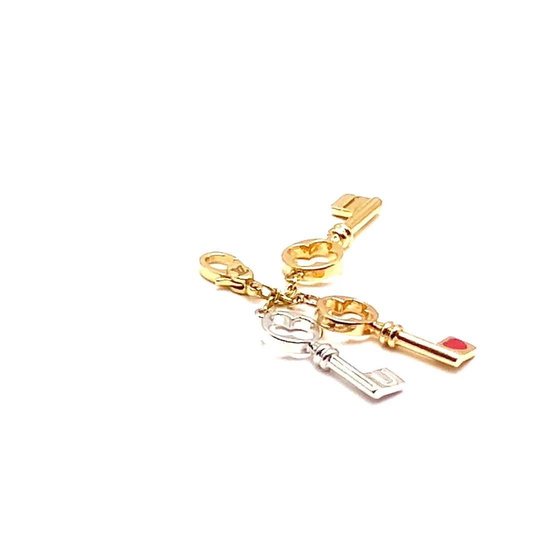 Rare! Louis Vuitton LV 18k Tri Color Gold Enamel Heart Three Keys Charm Pendant: Rare! Louis Vuitton LV 18k Tri Color Gold Enamel Heart Three Keys Charm Pendant About This Piece: This rare Louis Vuitton charm pendant features three keys, each crafted from 18k gold in three distinc