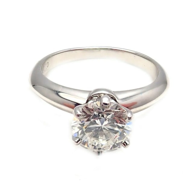 Authentic! Tiffany & Co. Platinum 1.13ct Diamond H VS1 XXX Engagement Ring Cert: Authentic! Tiffany & Co. Platinum 1.13ct Diamond H VS1 XXX Engagement Ring Cert About This Piece: Metal: Platinum Ring Size: Width at Top: 5 7.5mm Weight: 5.5g Stones: 1x Diamond 1.13ct H/VS1/XXX<br