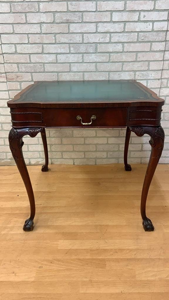 Vintage Chippendale Style Carved Mahogany Leather Top Game Table: Title: Vintage Chippendale Style Carved Mahogany Leather Top Game Table Description: Materials: wood, mahogany, leather Width: 30 inches Height: 30 inches Depth: 30 inches Vintage Chippendale Style Ca