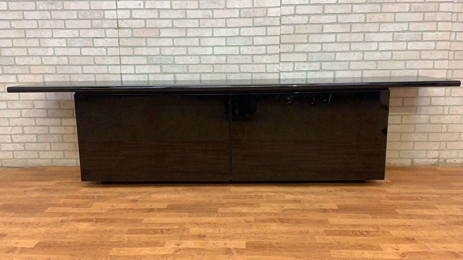 Mid Century Modern Acerbis International Black High Gloss Media Cabinet/Credenza: Title: Mid Century Modern Acerbis International Black High Gloss Media Cabinet/Credenza Description: Vintage from the 1970s Materials: wood, stainless steel, metal Width: 110 inches Height: 28 inches