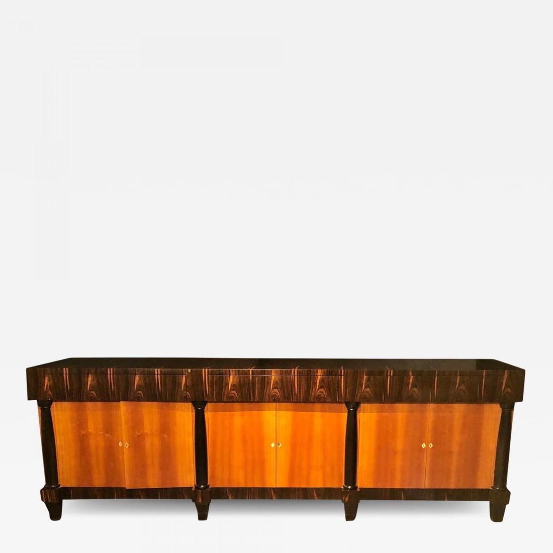 Palatial Six Door Macassar Sideboard Cabinet Ebonized Column and Feet Support: Title: Palatial Six Door Macassar Sideboard Cabinet Ebonized Column and Feet Support Description: A palatial six door Macassar sideboard cabinet. This fine French custom cabinet has ebonized column si