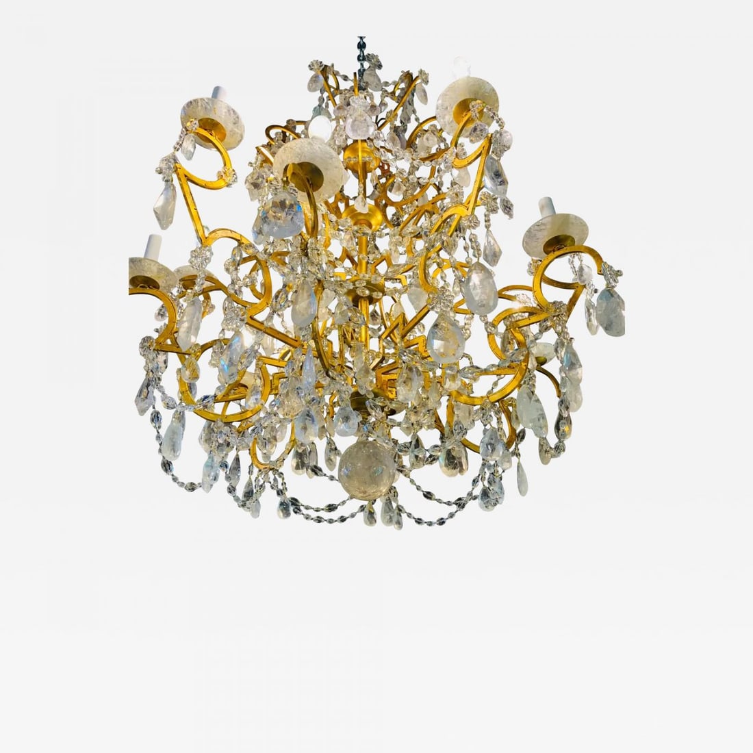 12 Light Gilt Metal Rock Crystal Chandelier. Hollywood Regency in Style: Title: 12 Light Gilt Metal Rock Crystal Chandelier. Hollywood Regency in Style Description: 12 Light Gilt Metal Chandelier Having Multiple Rock Crystal Prisms in the Hollywood Regency Style. This larg