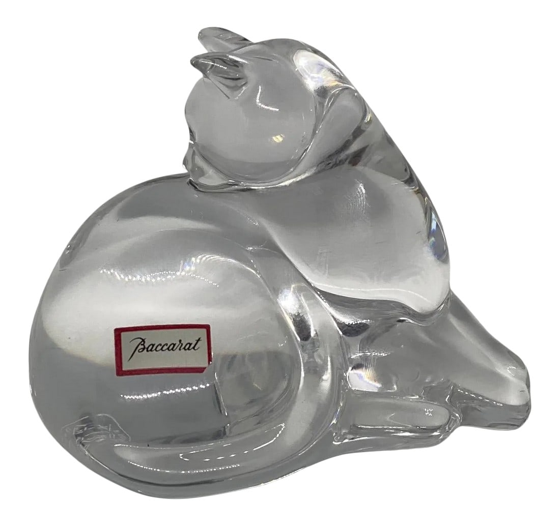 Late 20th Century Baccarat Crystal "Reclining Cat" Figurine: Beautiful and charming late 20th Century clear crystal study of a relaxed cat figurine in a reclining position grooming itself, with an excellent smooth tactile surface. It includes the Baccarat stamp