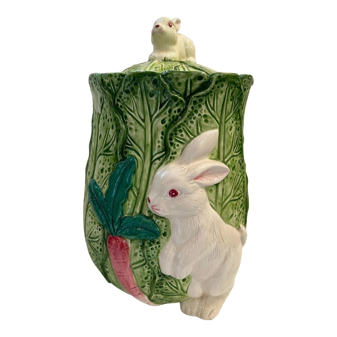 1991 Strata Group "Bunny Lane" Cabbage Majolica Style Canister or Cookie Jar: This whimsical cookie jar or large canister was produced by the Strata Group in 1991. Majolica style, it features two bunnies popping out of a cabbage plant with their carrots. There is also a small b