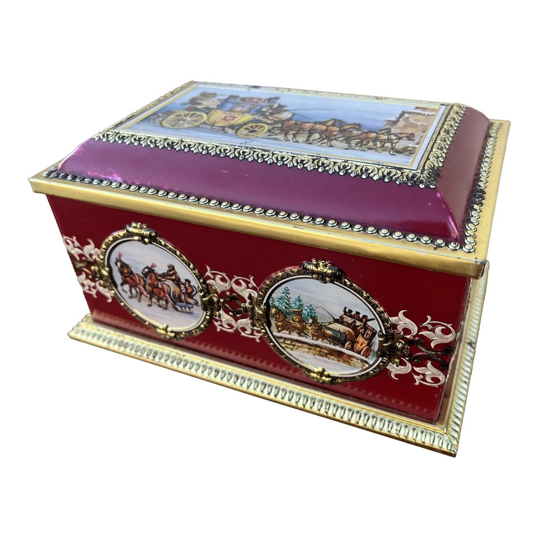 1970's Western Germany Christmas Cookie Tin Container: Made by Klann in Soviet Western Germany. A brass finished tin container with deep and rich red overlay. Embossed patterns and borders highlight painted Christmas and winter themed medallions. Horse dr