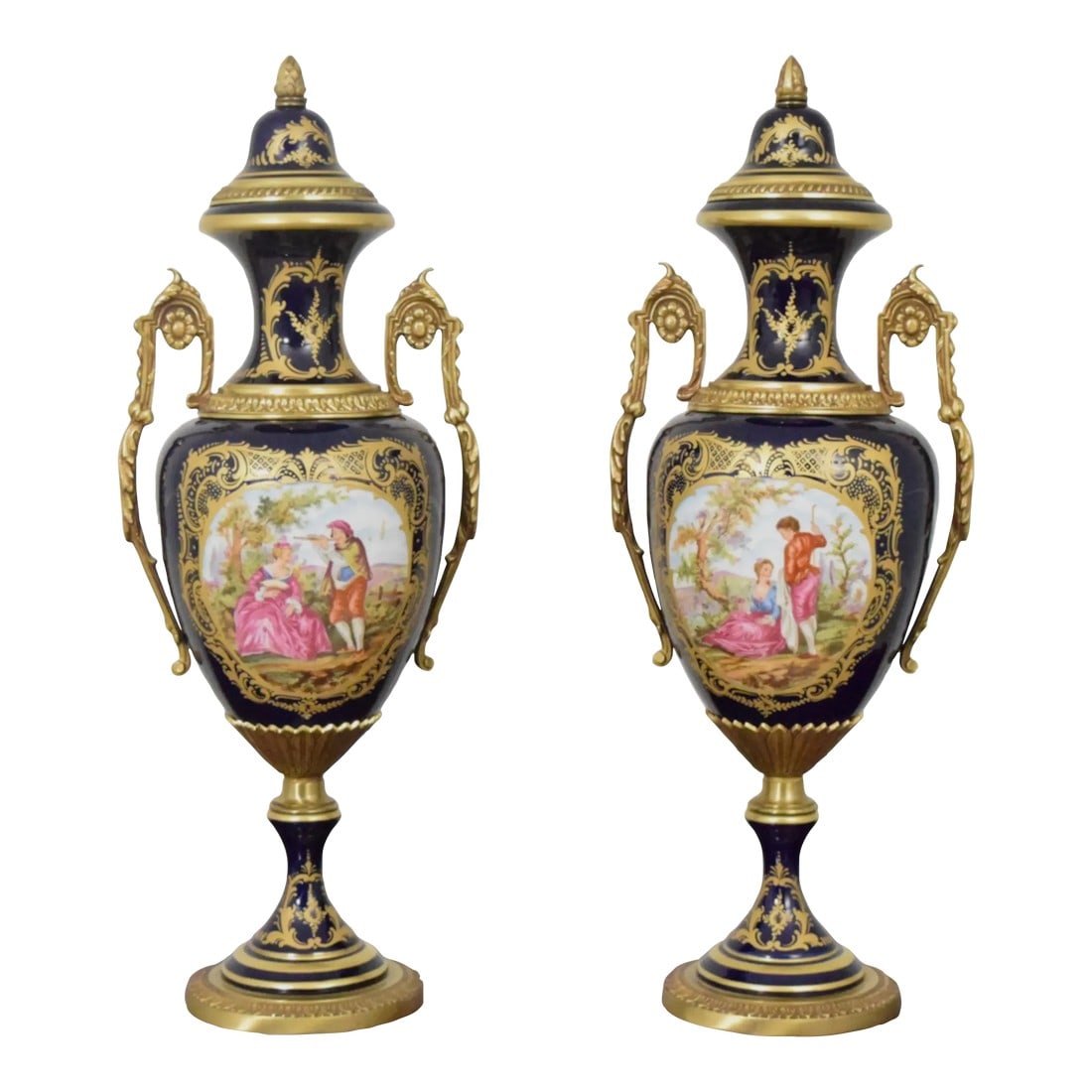Pair Vintage Sevres Porcelain Bronze Mounted Urns: Age: Approx: 60 Years Old Details: Marking On Bottoms High Quality Construction Nice Bronze Or Brass Ormolu Mounts & Base Blue Porcelain w. Nice Decorated Fronts Stunning Decorator Urns French Style C