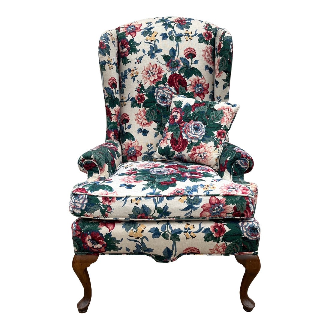 Vintage Bright Floral Queen Anne Wingback Arm Chair: Beautiful floral designed vintage wingback arm chair. Low arms and narrow, low profile wings give a unique take on the traditional bold design shape of other wingback chairs. With cherry legs in a Que