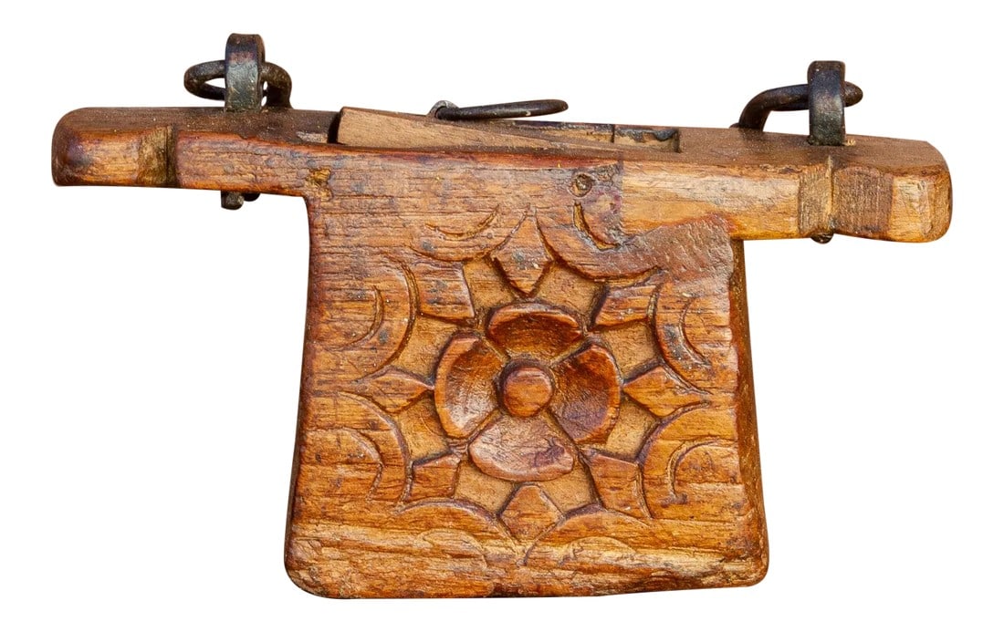 Antique Chameli Carved Tea Caddy: This lovely carved artifact was originally used to store tea leaves. This tea canister is hand-carved from blocks of cedar wood with floral motifs and it retains its original iron handle. It will make