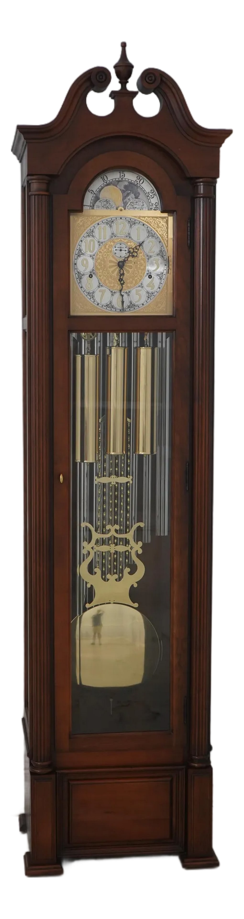Howard Miller Cherry Tall Case Grandfather Clock: Age: Approx: 40 Years Old Details: Beveled Glass Pediment Top w. Finial Multi Chime Settings Currently In Working Order Brass Triple Weight Driven Movement Condition: Excellent Original Finish & Condi