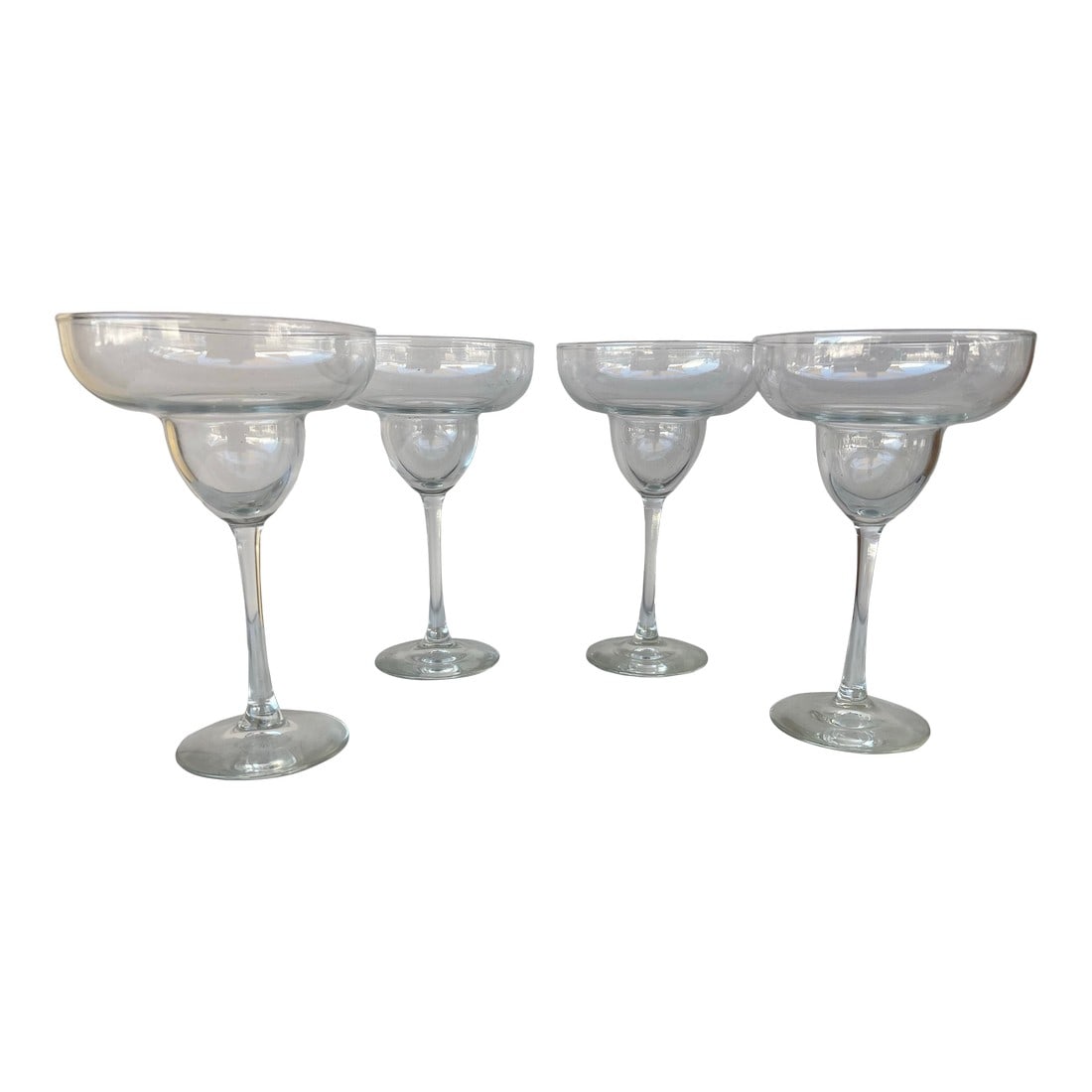 Vintage Clear Stemmed Margarita Glasses 4: Set of 4 Clear Stemmed Margarita Glasses by 7.5"Tall. Condition: Alterations: Original Condition Unaltered Imperfections: Some Imperfections Condition Notes: Excellent condition. Dimensions: Height: 7